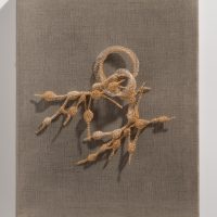 Tethered (there is a pain), 2025, 12K gold-filled wire and silver-plated wire, 11 x 14 x 3”